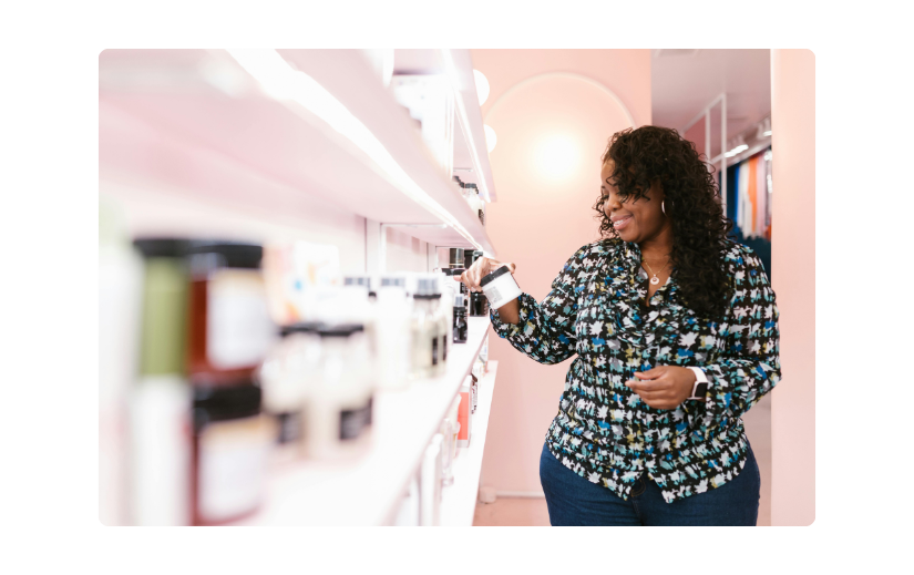 Woman exploring products in a bright retail store, representing affiliate marketing strategies for online retail success.